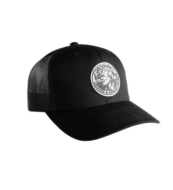 Black trucker cap with a circular patch featuring a portrait and text