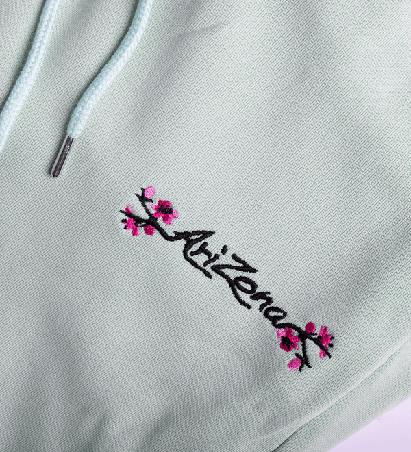 Teal Cherry Blossom Sweatpants Close-up Front Image