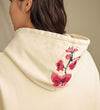 Heritage Blossom Hoodie Ivory Lifestyle Image Hood Close Up