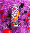 A can of Arizona Hot Wheels Energy Drink, flavor Ice Berry, is shown floating in clear liquid with ice cubes and fresh berries (strawberries, blackberries, blueberries) against a vibrant purple background.