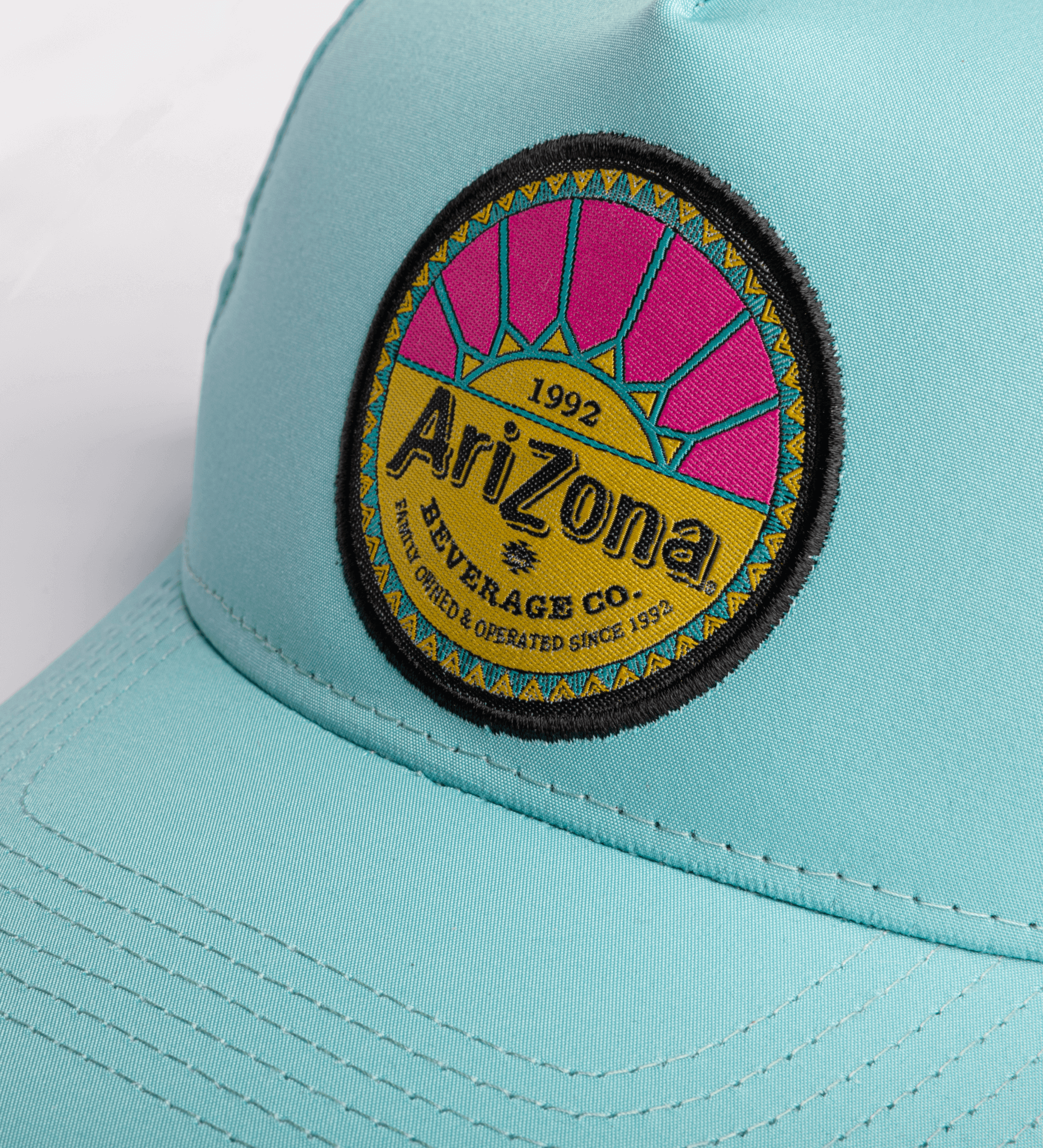Blue Sunburst Snapback Hat Close Up Logo