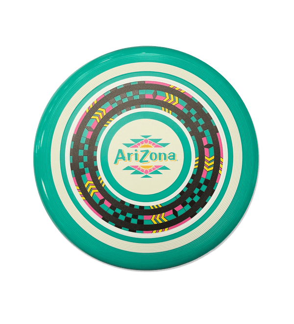 A circular flying disc with a turquoise outer ring, concentric white and dark gray rings, and a central cream circle featuring the 'AriZona' brand name and geometric patterns in pink, yellow, and teal, set against a solid black background.