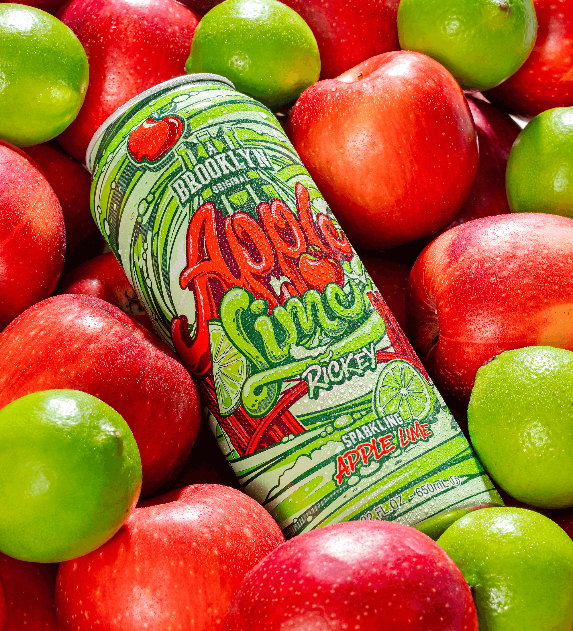 Can of 'A Brooklyn' Apple Lime Rocket sparkling apple lime drink surrounded by red and green apples.