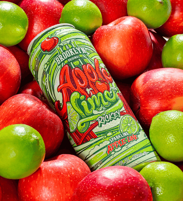 Can of 'A Brooklyn' Apple Lime Rocket sparkling apple lime drink surrounded by red and green apples.