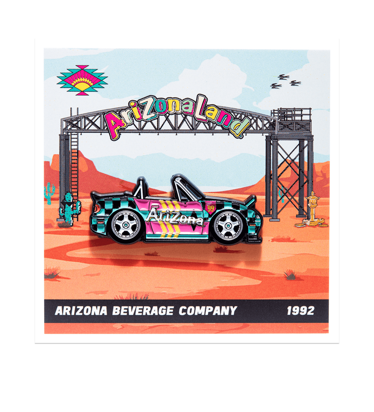 A collectible enamel pin of a 1992 Arizona Beverage Company car, styled like the Arizona Land Archway sign, set against a desert landscape background. The pin is presented on a white card with a black bottom banner reading 'ARIZONA BEVERAGE COMPANY 1992'.