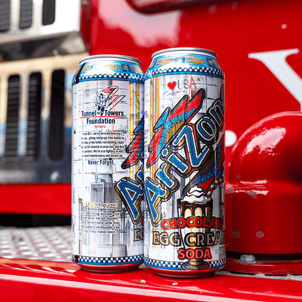 Two Arizona Chocolate Egg Cream Soda cans on a red vehicle 