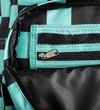 Close-up of a backpack showing a black and mint green checkered pattern, a zippered pocket with a silver zipper pull, and a black interior lining.