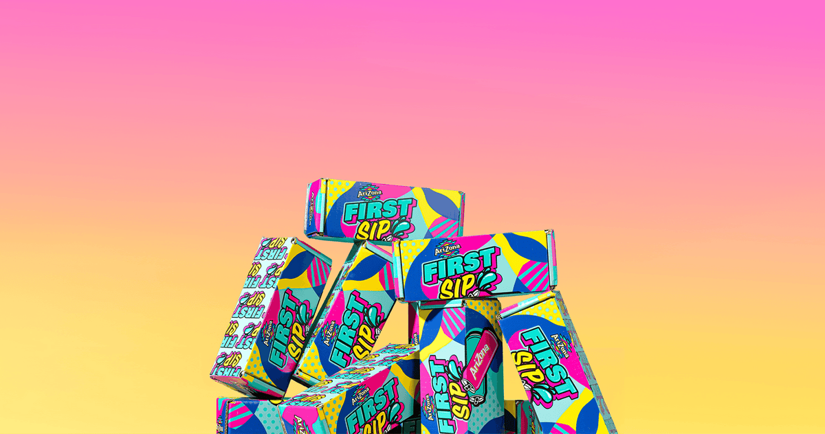 A stack of colorful First Sip boxes arranged in a pyramid against a pink-to-yellow gradient background.