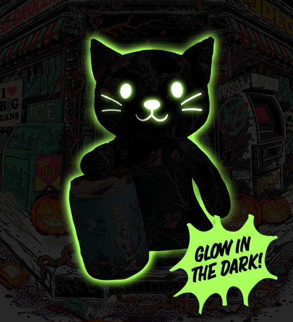 A black cat-shaped glow-in-the-dark product shown against a dark illustrated Halloween storefront background. The cat has a bright neon green glow around it.