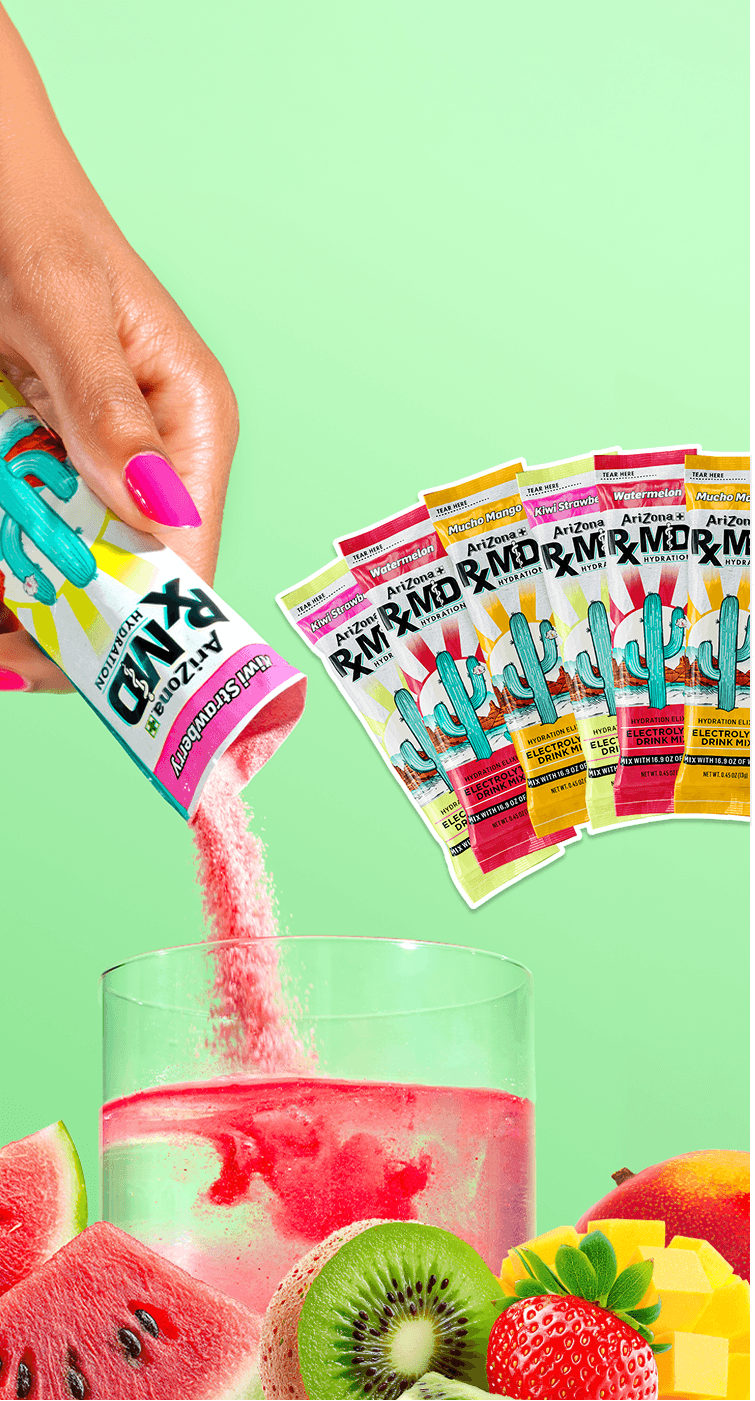 Hand pouring az rxmd mix into a glass with colorful packaging on a green background